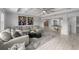 Spacious living room with comfortable seating and stylish decor for relaxation and socializing at 7819 Notched Pine Bnd, Wesley Chapel, FL 33545