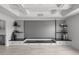 Home theater setup with custom shelving offers a modern and organized entertainment space at 7819 Notched Pine Bnd, Wesley Chapel, FL 33545