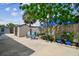 Inviting backyard with a shed, patio, landscaped area, and seating for relaxation and outdoor enjoyment at 8006 Tanglewood Ln, Tampa, FL 33615