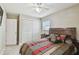 Comfortable bedroom with a ceiling fan, large closet, and a comfortable bed, creating a serene retreat at 8006 Tanglewood Ln, Tampa, FL 33615