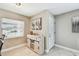 Inviting entryway featuring a decorative cabinet and stylish front door with glass detailing at 8006 Tanglewood Ln, Tampa, FL 33615