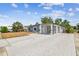 Charming single-story home with unique gated entrance, long drive and large yard at 8006 Tanglewood Ln, Tampa, FL 33615
