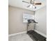 Compact home gym with a treadmill, tile floors, and a window providing natural light at 8006 Tanglewood Ln, Tampa, FL 33615