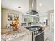 Kitchen featuring granite countertops, stainless steel appliances, and view into the living room at 8006 Tanglewood Ln, Tampa, FL 33615
