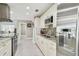 Modern kitchen featuring stainless steel appliances, granite countertops, and stylish tile backsplash at 8006 Tanglewood Ln, Tampa, FL 33615