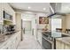 Well-lit kitchen featuring granite countertops, stainless steel appliances, and tile floors at 8006 Tanglewood Ln, Tampa, FL 33615