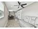 Cozy living space featuring tile floors, ceiling fan, dining area and comfortable seating at 8006 Tanglewood Ln, Tampa, FL 33615