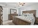 Bedroom with rustic wood furniture, neutral decor, and natural light at 8006 Tanglewood Ln, Tampa, FL 33615