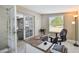 Functional office with great lighting and an inviting workspace, adjacent to the living room at 8006 Tanglewood Ln, Tampa, FL 33615