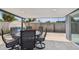 Comfortable outdoor seating area with a round table and chairs plus exterior backyard access at 8006 Tanglewood Ln, Tampa, FL 33615