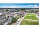 Community aerial view featuring a pool, lawn bowling, and picturesque landscaping at 904 Desert Hills Dr, Sun City Center, FL 33573