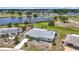 Aerial view of house showing lake and surrounding neighborhood at 904 Desert Hills Dr, Sun City Center, FL 33573