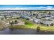 Residential community with lake and lush green landscaping at 904 Desert Hills Dr, Sun City Center, FL 33573