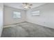 This carpeted bedroom is bright, offering a blank canvas for your personal touch at 904 Desert Hills Dr, Sun City Center, FL 33573