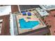 Aerial shot showcasing the community pool, seating areas, and well-maintained recreational space at 904 Desert Hills Dr, Sun City Center, FL 33573