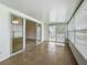 Bright sunroom with tile, sliding glass doors, and windows for natural light and flexible living at 904 Desert Hills Dr, Sun City Center, FL 33573