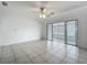 Open living room with sliding glass doors and tile flooring at 904 Desert Hills Dr, Sun City Center, FL 33573