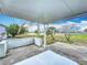 Covered patio offers views of the community lake and surrounding landscape at 904 Desert Hills Dr, Sun City Center, FL 33573