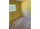 Modest bedroom featuring a window for natural light and carpeted floor at 531 Carriage Hills Dr, Temple Terrace, FL 33617