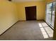 Bright bedroom with natural light from large window and large closet with sliding doors at 531 Carriage Hills Dr, Temple Terrace, FL 33617