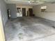 Spacious garage featuring laundry machines, water heater, and ample room for parking at 531 Carriage Hills Dr, Temple Terrace, FL 33617