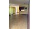 Open-concept living room featuring stylish flooring and an adjoining kitchen counter bar at 531 Carriage Hills Dr, Temple Terrace, FL 33617
