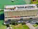 Aerial view of the building highlighting a ground-level patio at 100 Bluff View Dr # 105C, Belleair Bluffs, FL 33770