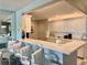 Bright kitchen bar featuring white cabinets and a modern, marble-look countertop with seating at 100 Bluff View Dr # 105C, Belleair Bluffs, FL 33770