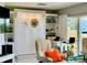 Comfortable living room with tile flooring, a built in wall unit, and recliner chairs at 100 Bluff View Dr # 105C, Belleair Bluffs, FL 33770