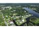 Aerial view displaying property located on a peninsula with canal access and well-maintained lawn at 10922 Park Dr, Riverview, FL 33569