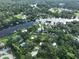 Beautiful aerial shot showcasing the community, canal, lake and surrounding trees at 10922 Park Dr, Riverview, FL 33569