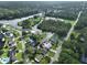 Aerial view of neighborhood homes on river with private docks and community boat ramp at 10922 Park Dr, Riverview, FL 33569