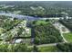 Stunning aerial view of the property showcasing waterfront access and lush green surroundings at 10922 Park Dr, Riverview, FL 33569