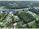 Aerial view of neighborhood homes on river with private docks and community boat ramp at 10922 Park Dr, Riverview, FL 33569