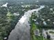 Breathtaking aerial view showcasing the waterway with homes situated along the canal and lake at 10922 Park Dr, Riverview, FL 33569