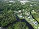 Aerial view showing the property's proximity to the water, canal, and lush landscape at 10922 Park Dr, Riverview, FL 33569