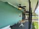 Covered back patio with ceiling fans providing a comfortable outdoor space at 10922 Park Dr, Riverview, FL 33569
