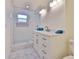 Modern bathroom with white tile, a vanity, and a glass-enclosed shower at 10922 Park Dr, Riverview, FL 33569