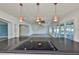 Open concept kitchen with a large island, a cooktop, and a view of the large outdoor deck at 10922 Park Dr, Riverview, FL 33569