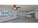 Bright, open floor plan featuring wood floors, large windows and a modern kitchen with an island at 10922 Park Dr, Riverview, FL 33569