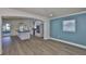 Spacious open-concept living area features a modern kitchen and recessed lighting at 10922 Park Dr, Riverview, FL 33569