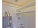 Clean utility room with a water heater, shelving, and modern fixtures at 10922 Park Dr, Riverview, FL 33569