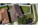 Birds-eye view of the home, highlighting the roof, fenced yard, landscaping, and proximity to sidewalks at 11021 Silver Dancer Dr, Riverview, FL 33579
