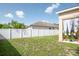 View of the backyard, which features a white privacy fence at 11021 Silver Dancer Dr, Riverview, FL 33579