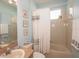 The bathroom features a vanity, toilet, framed art and shower/tub combination at 11021 Silver Dancer Dr, Riverview, FL 33579