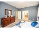 Primary bedroom featuring dresser and ensuite bathroom access with walk-in closet at 11021 Silver Dancer Dr, Riverview, FL 33579