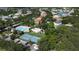 Aerial shot of community amenities including a pool, tennis court, playground, and parking area, enhancing leisure at 11021 Silver Dancer Dr, Riverview, FL 33579