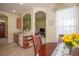 Bright kitchen nook area with wood floors, and yellow accents at 11021 Silver Dancer Dr, Riverview, FL 33579