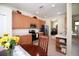Well-appointed kitchen with wood cabinets, stainless steel appliances, and a breakfast bar at 11021 Silver Dancer Dr, Riverview, FL 33579