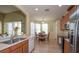 Open kitchen design with stainless steel appliances and adjacent dining area at 11021 Silver Dancer Dr, Riverview, FL 33579